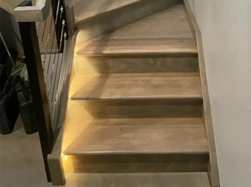 Lighted stairs with railing